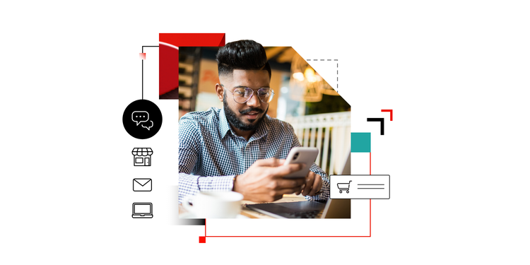 A man in an office uses his phone to learn the difference between omnichannel and multichannel marketing.