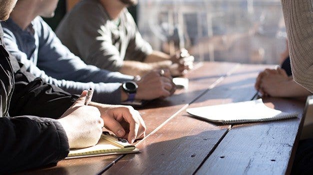 Corporate team setting business goals