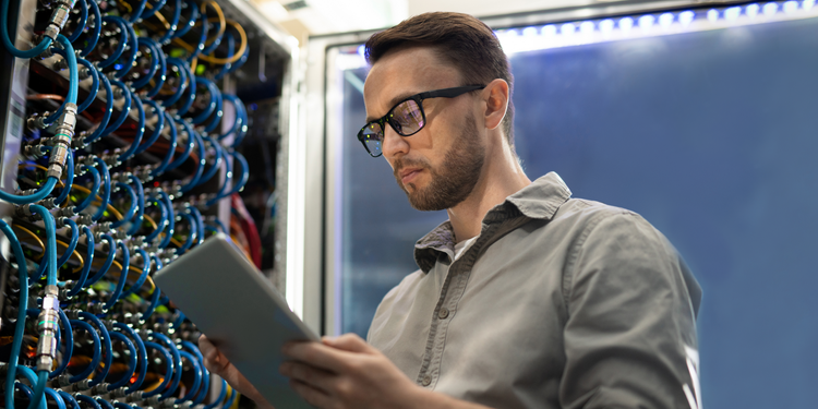 Man reading cloud computing data on tablet