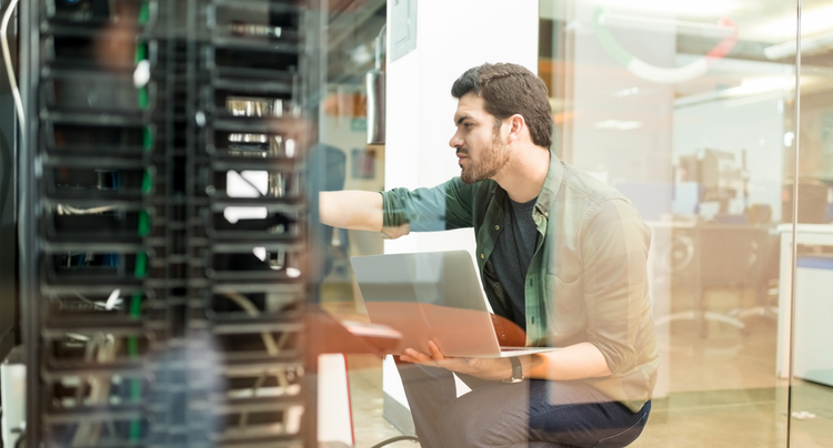 An IT professional working on business servers