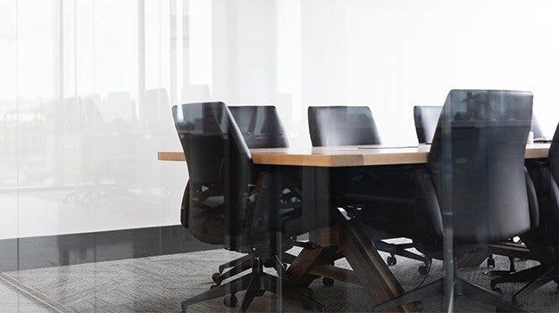 Empty chairs in conference room