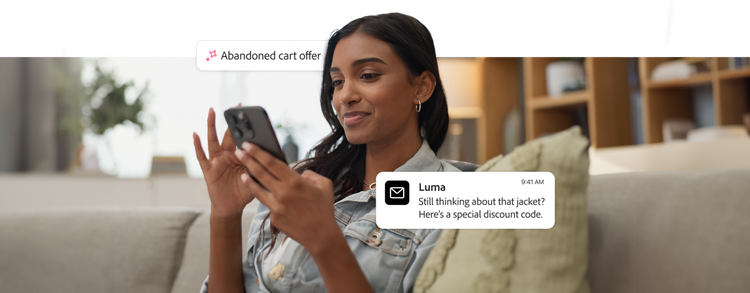 A young woman sits on a couch, smiling while looking at her phone. Overlaid UI elements show an 'Abandoned basket offer' notification and a message from 'Luma' that reads, 'Still thinking about that jacket? Here's a special discount code.’