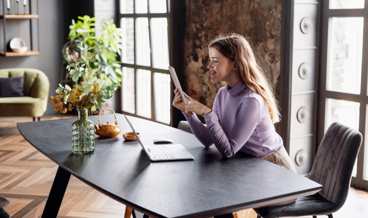 Women using a tablet in an office