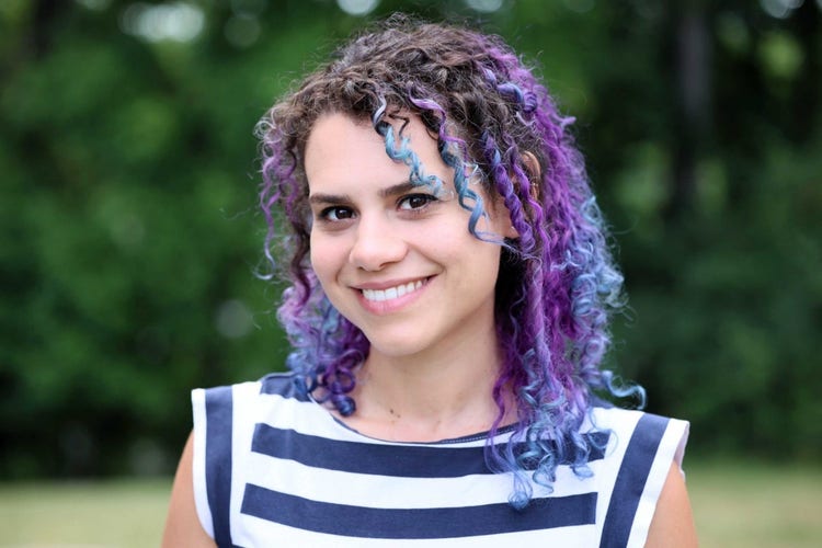 A person with purple hair Description automatically generated with medium confidence