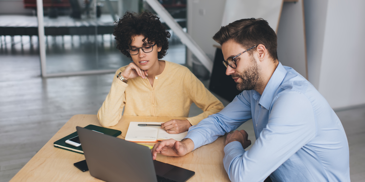 Two professionals defining a performance marketing strategy