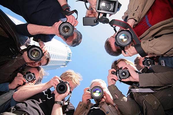 Group of photographers holding cameras