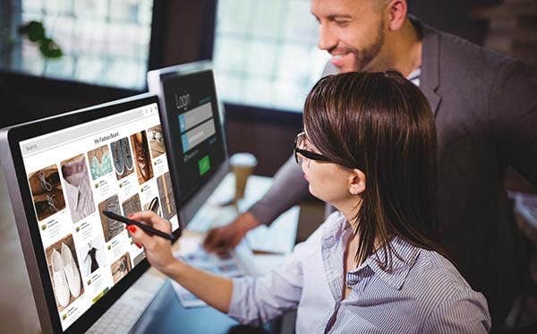 photographers reviewing images on monitor