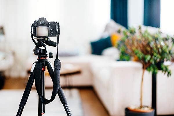 camera on tripod in home setting