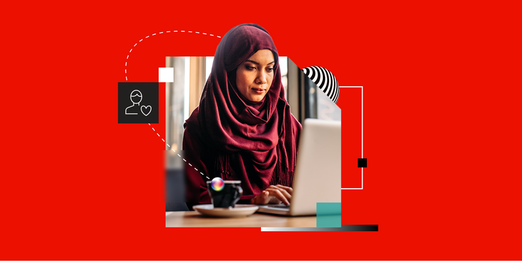 A woman working on a laptop receives personalized marketing.