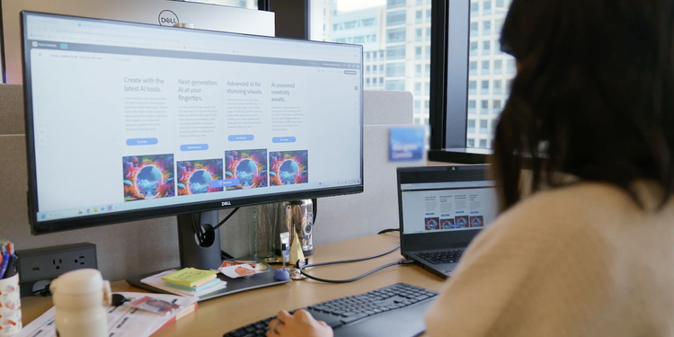 Woman working in an office, using Adobe Creative Cloud Pro Edition to increase content output.