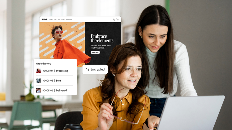 Two women use a laptop to review the order history from an Adobe Commerce website.
