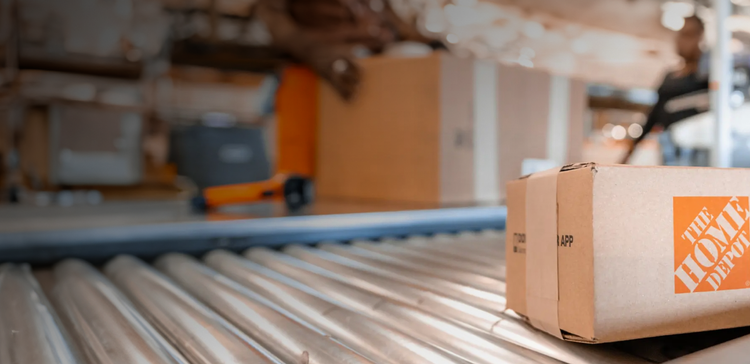 background image of Home Depot box on conveyor belt