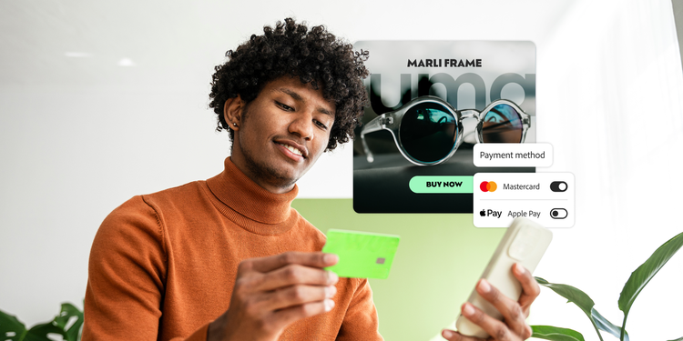 クレジットカードを持ち、携帯電話で支払いをしている男性。製品および支払い方法のUI要素のオーバーレイ