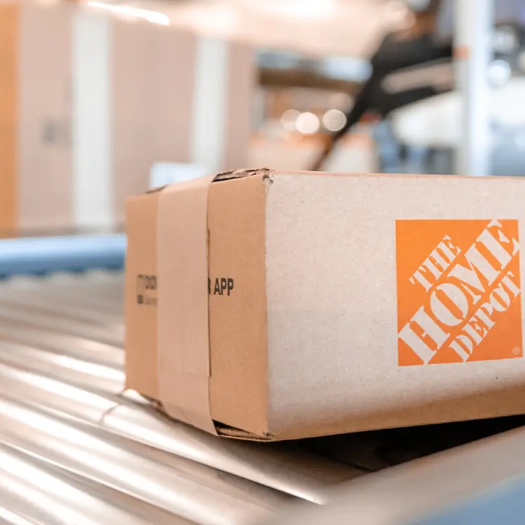 Home Depot package on a conveyor belt.