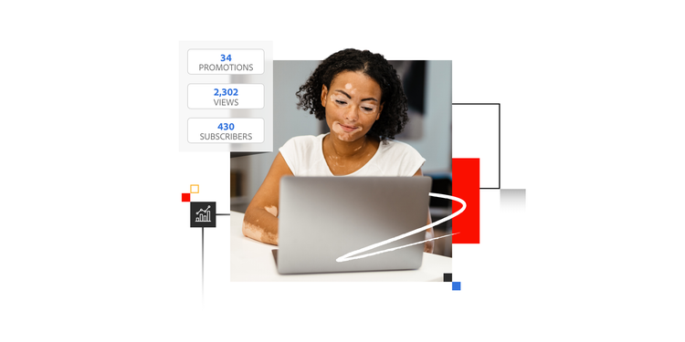 A woman reads on her laptop about how a marketing strategy helps achieve business goals.