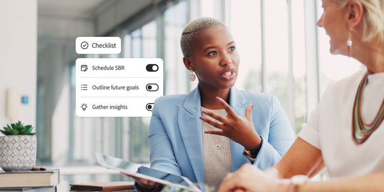 Two women sitting in an office. One woman holding a tablet speaking to the other. Overlaid with a checklist with steps to complete a business review.