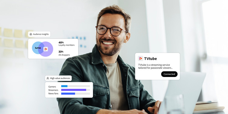 Marketing professional at a laptop with audience insights and streaming data overlays, illustrating Adobe Real-Time CDP Collaboration.