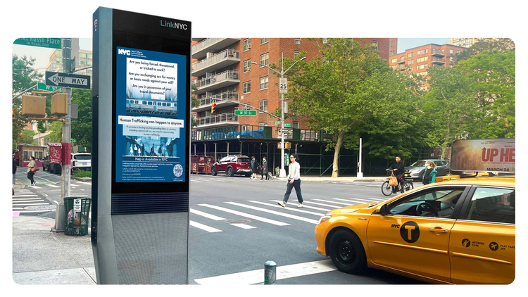 Human Trafficking campaign images on a NYC street kiosk in city centre